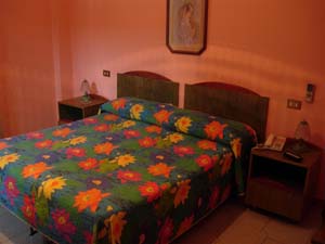 Standard single with city view, balcony, private facilities (bath and shower), and breakfast